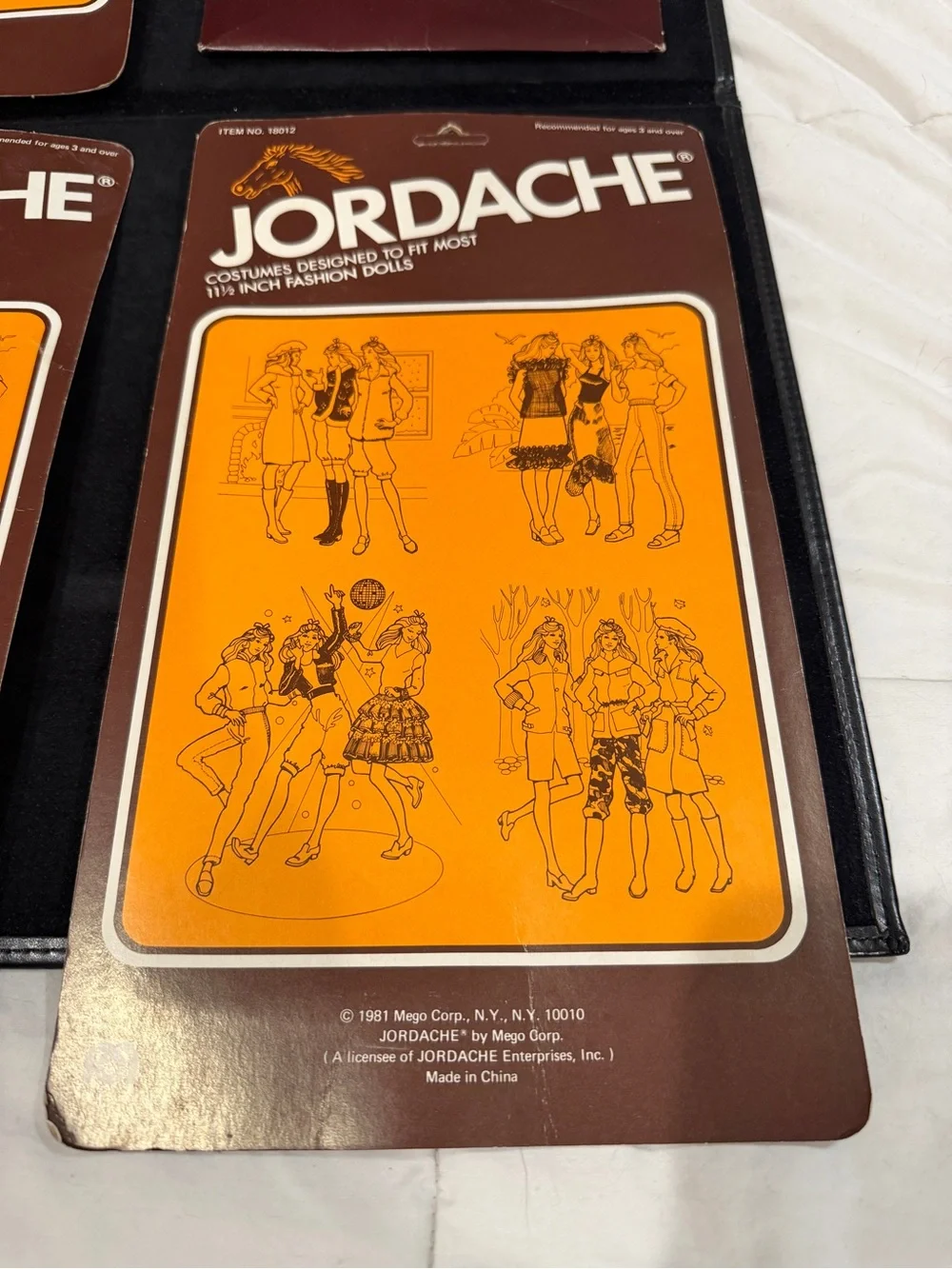 Vintage 70’s/80’s Jordache Pack of Four Doll Outfits in Pink, Black, Red, Yellow